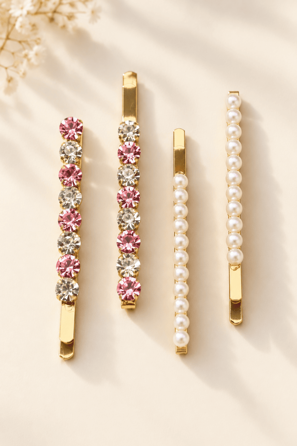 Gold-tone hair clips with alternating pink and clear round crystals and white imitation pearl embellishments