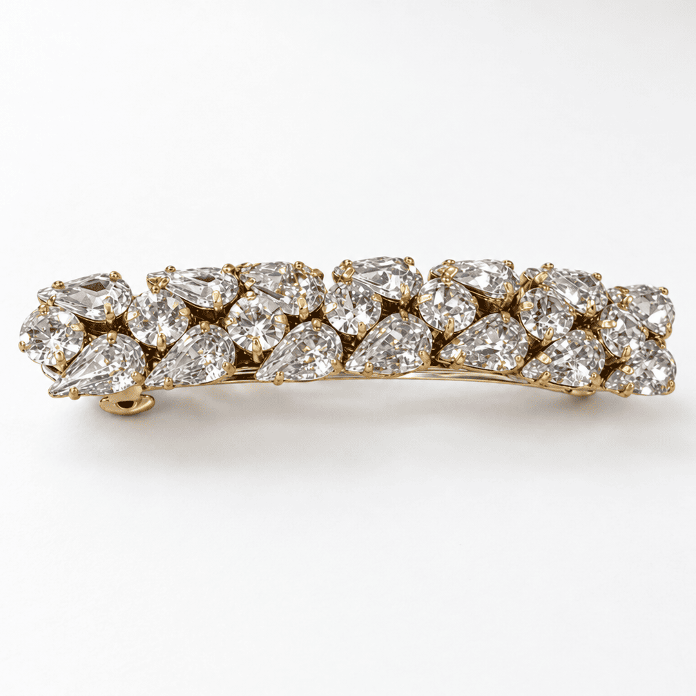Gold-tone crystal statement barrette with clear pear-shaped and round rhinestones arranged in a sparkling cluster.