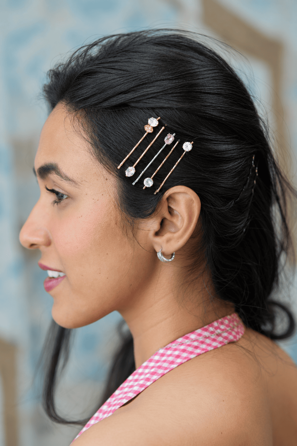 Crystal bobby pins with clear and amber crystals in a side hairstyle