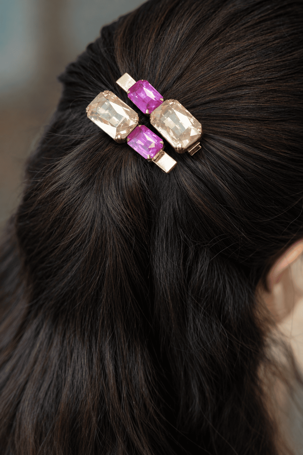 Pink and champagne crystal rhinestone hair clips styled in a girl's hair