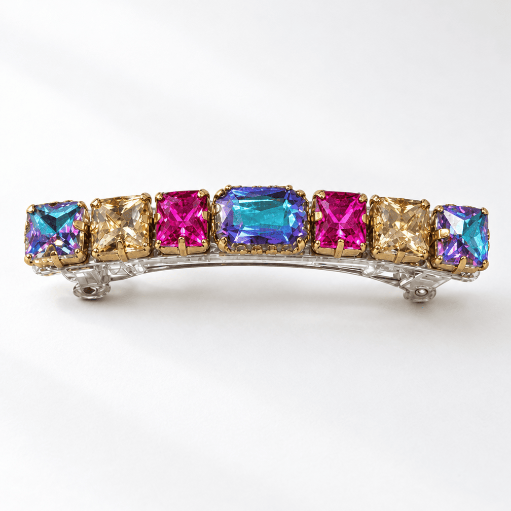 Gold-tone crystal barrette with geometric blue, pink, magenta and champagne-coloured stones.