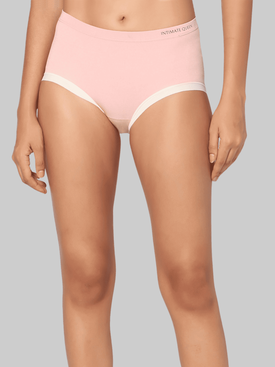 Pink underwear worn by a model on a gray background
