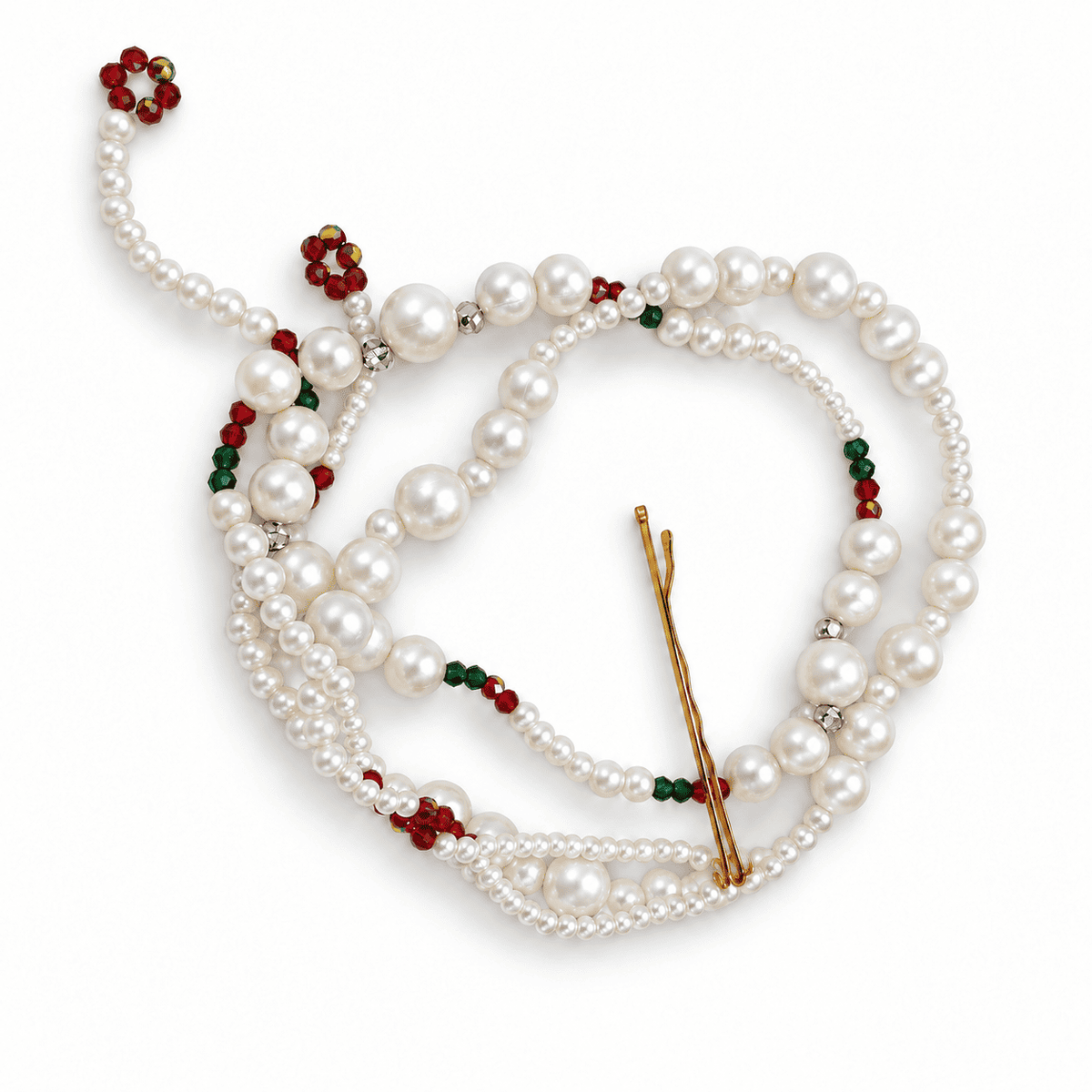 Pearl parandi hair accessory with red and green glass beads and a bobby pin on a white background