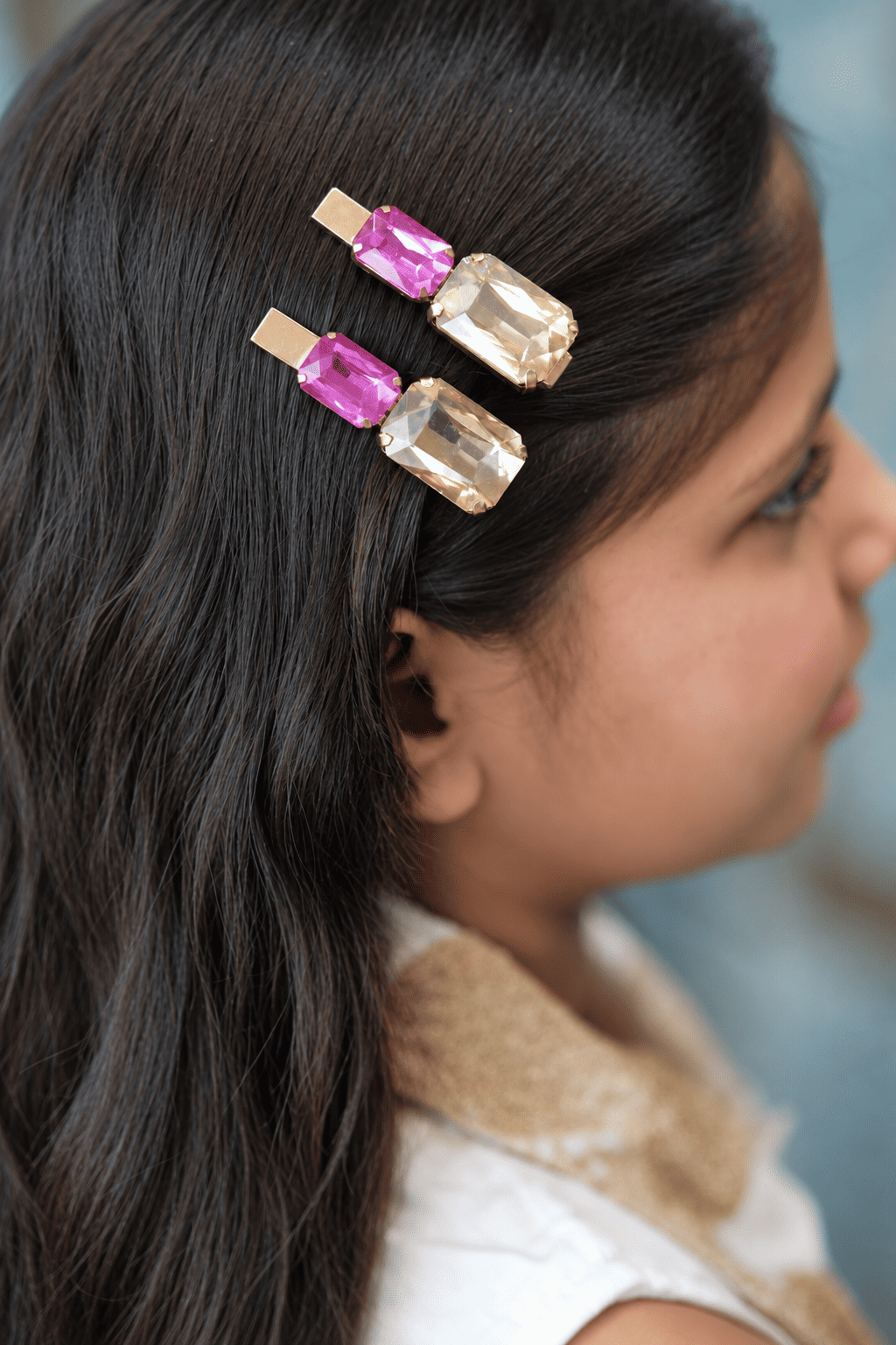 Gold-tone hair clips with hot-pink and champagne rectangular rhinestones